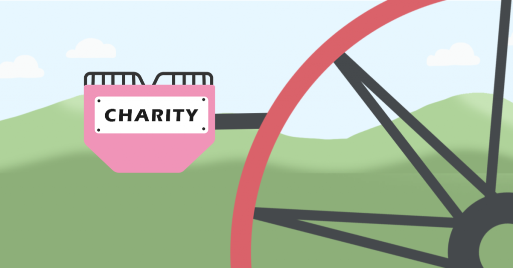 This is a picture of the red ferris wheel, with a pink passenger car with 'Charity' on the side