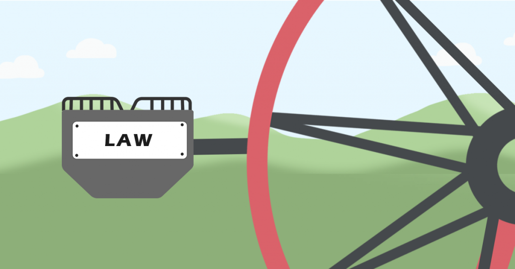 This is a picture of the red ferris wheel, with a grey passenger car with 'Law' on the side